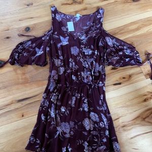 gorgeous purple romper with bird pattern. Has open shoulders.